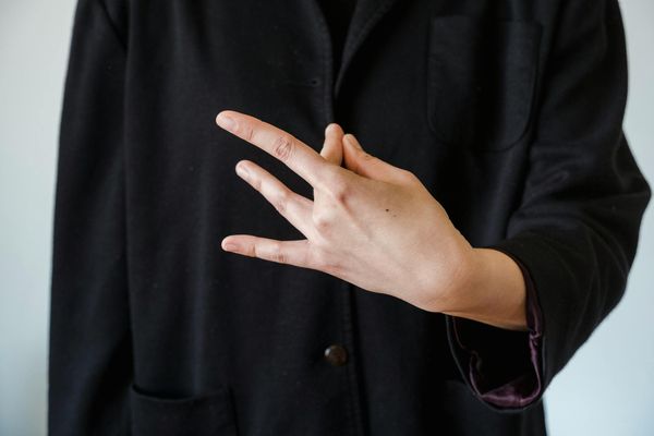 Close up of hands in a mudra position during meditation.